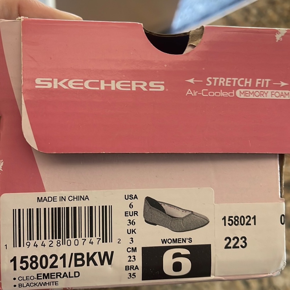 Slip on black and white flats